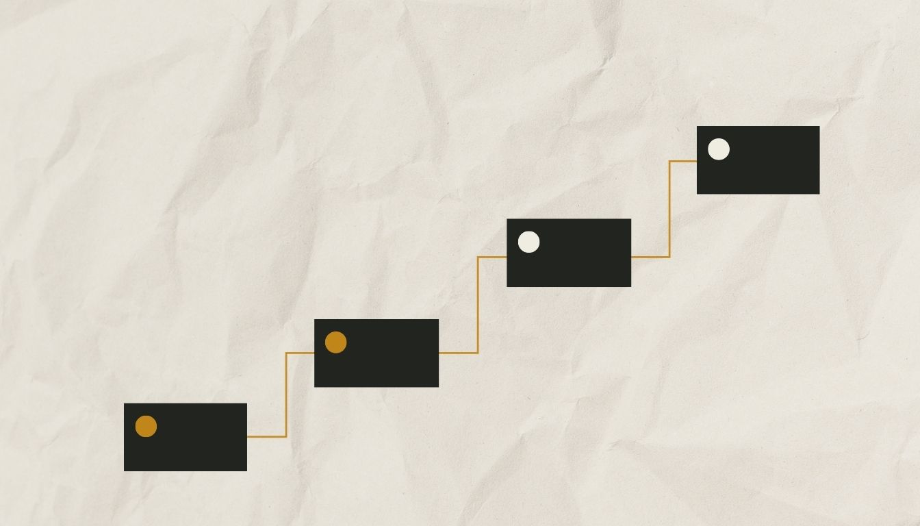 A staircase of connecting blocks rising left to right, representing the escalating stages of writing a dissertation